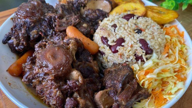 Oxtail Stew Served with Rice & Peas with Fried Plantain